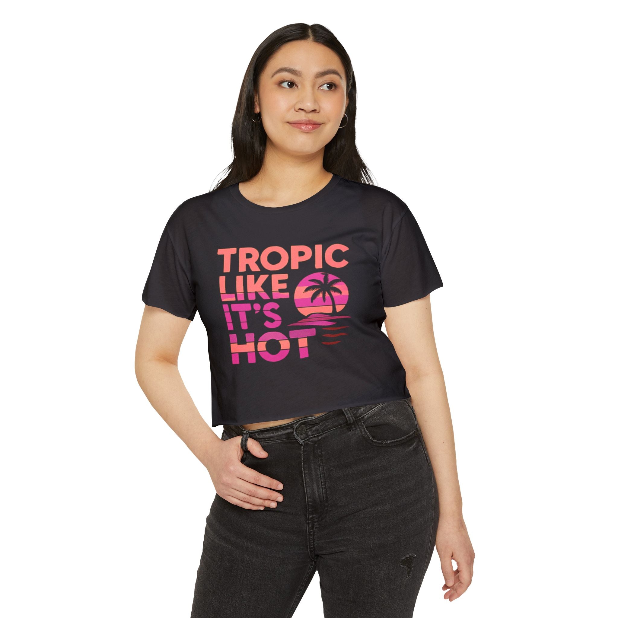Woman wearing a black t-shirt with pink text and palm tree graphic on a white background