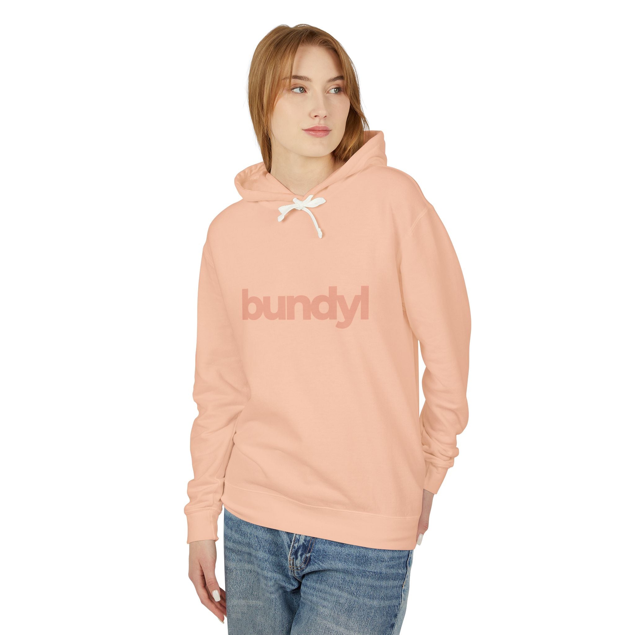 Person wearing a pink hoodie with 'bundyl' text